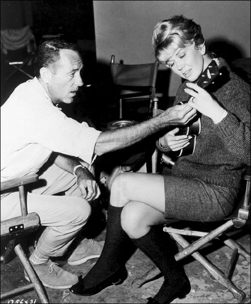 Doris Day gets a lesson from David Niven