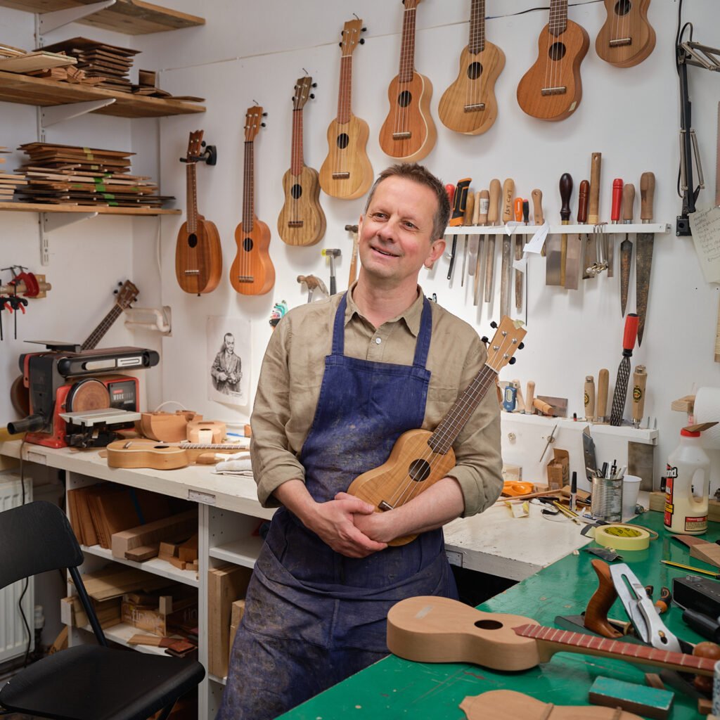 Will standing in his workshop making ukuleles